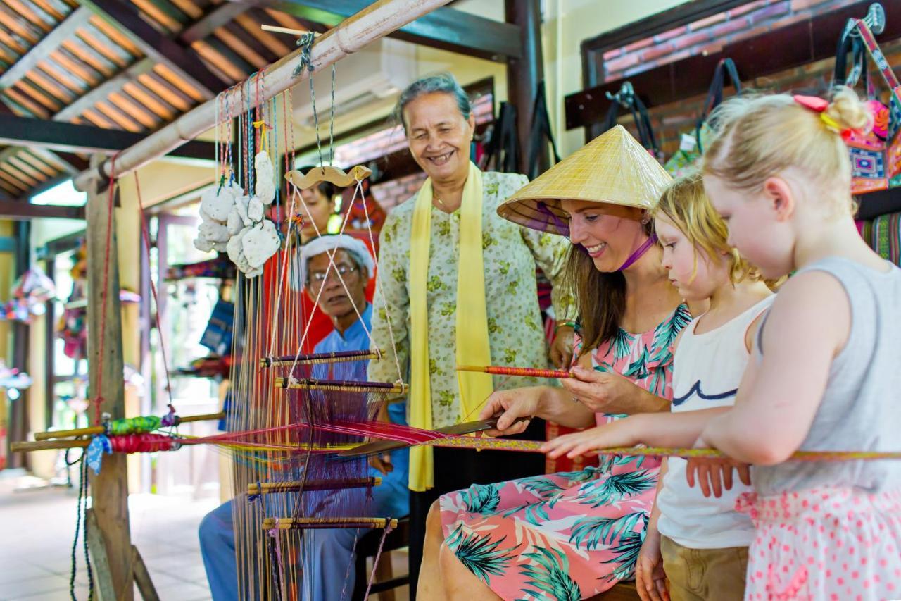 Mulberry Collection Silk Village Χόι Αν Εξωτερικό φωτογραφία Vietnamese tourists at the Water Puppet Theatre in Hanoi